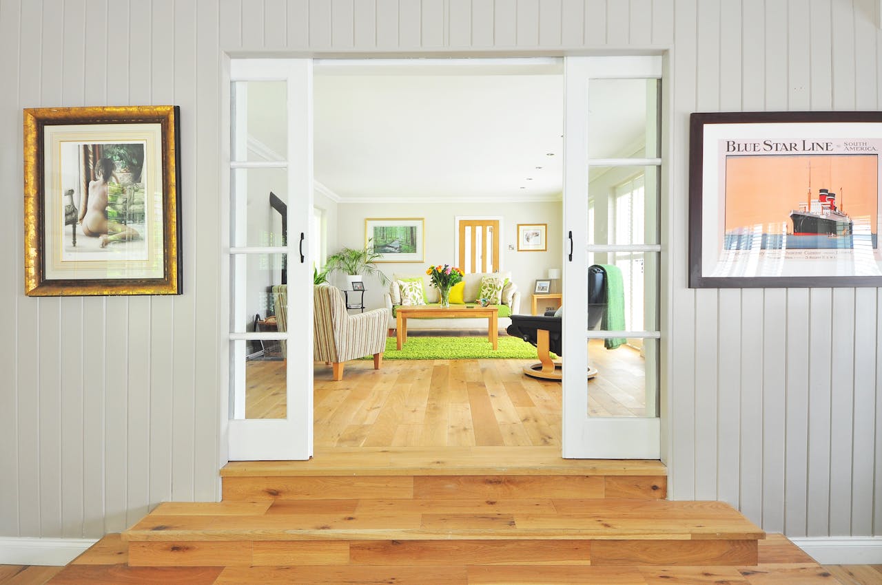 doorway-looking-into-white-living-room-with-green-rug doorway-looking-into-white-living-room-with-green-rug